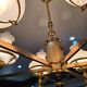 Large antique Empire-style chandelier — gilded brass & opaline glass