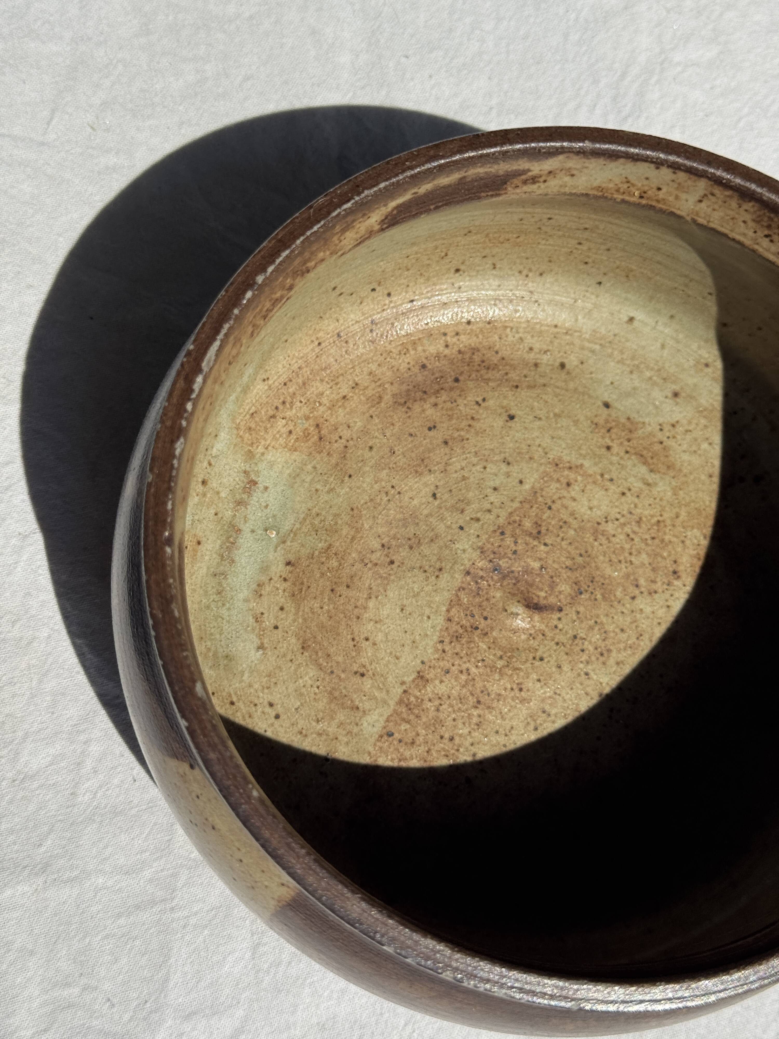 A small stoneware bowl, brown exterior, speckled grey interior D15