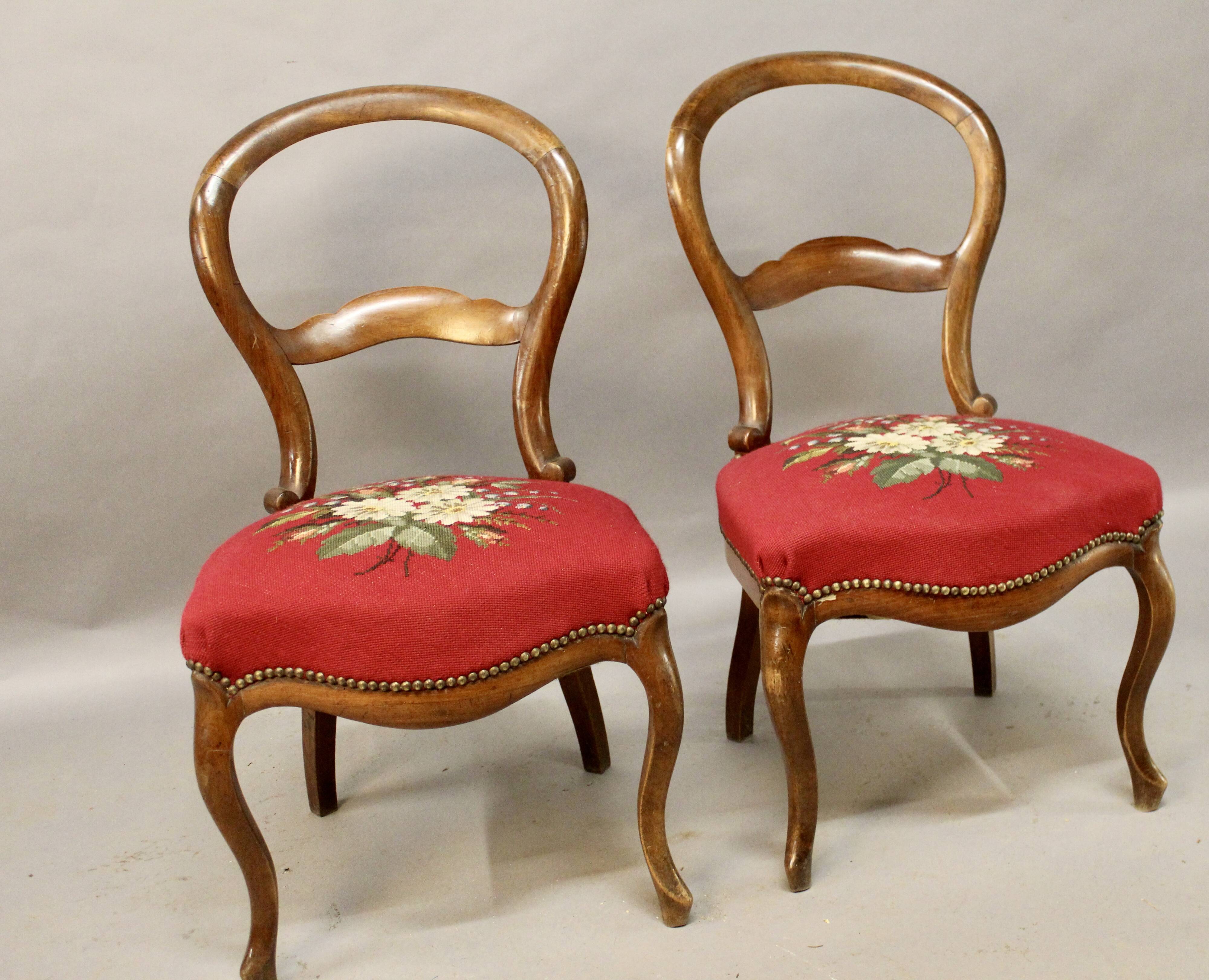 Pair of Louis Philippe walnut chairs, petit point tapestry