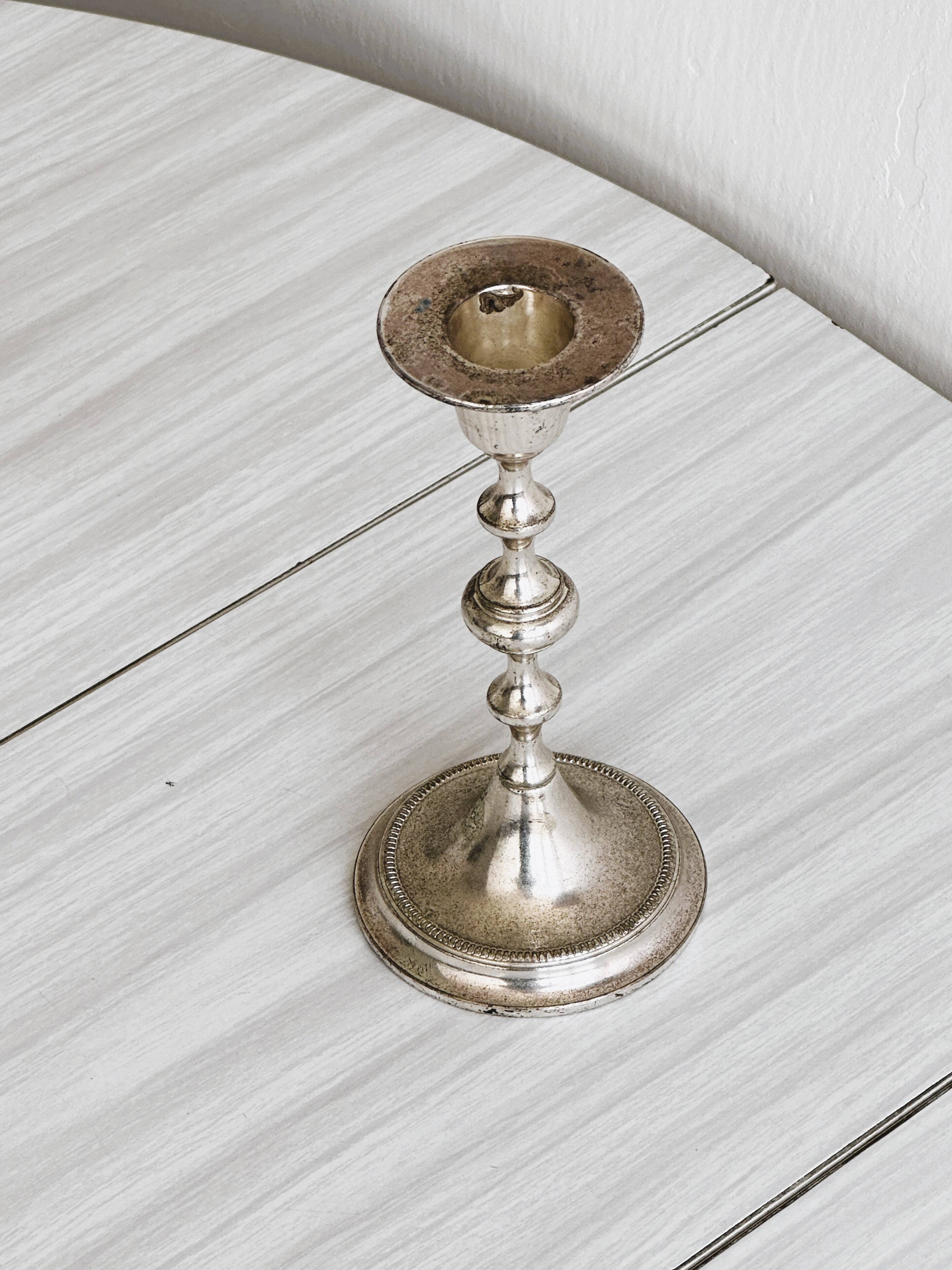 Small patinated candle holder.