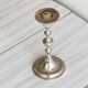 Small patinated candle holder.