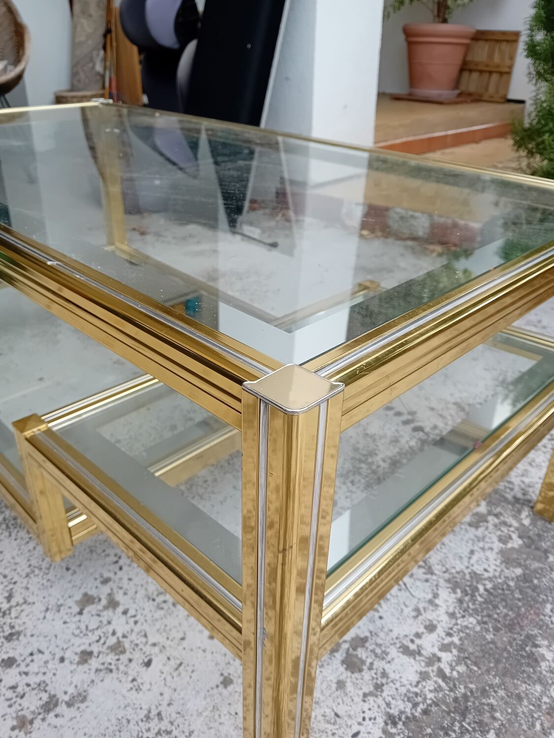 Glass and golden brass coffee table