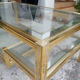 Glass and golden brass coffee table