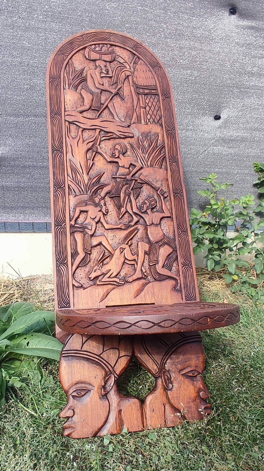 Old African wooden carved talking chair.