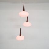 Set of three milk glass and teak pendant lights model NG74 by Louis Kalff for Philips, The Netherlan