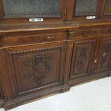 Glass-fronted walnut bookcase