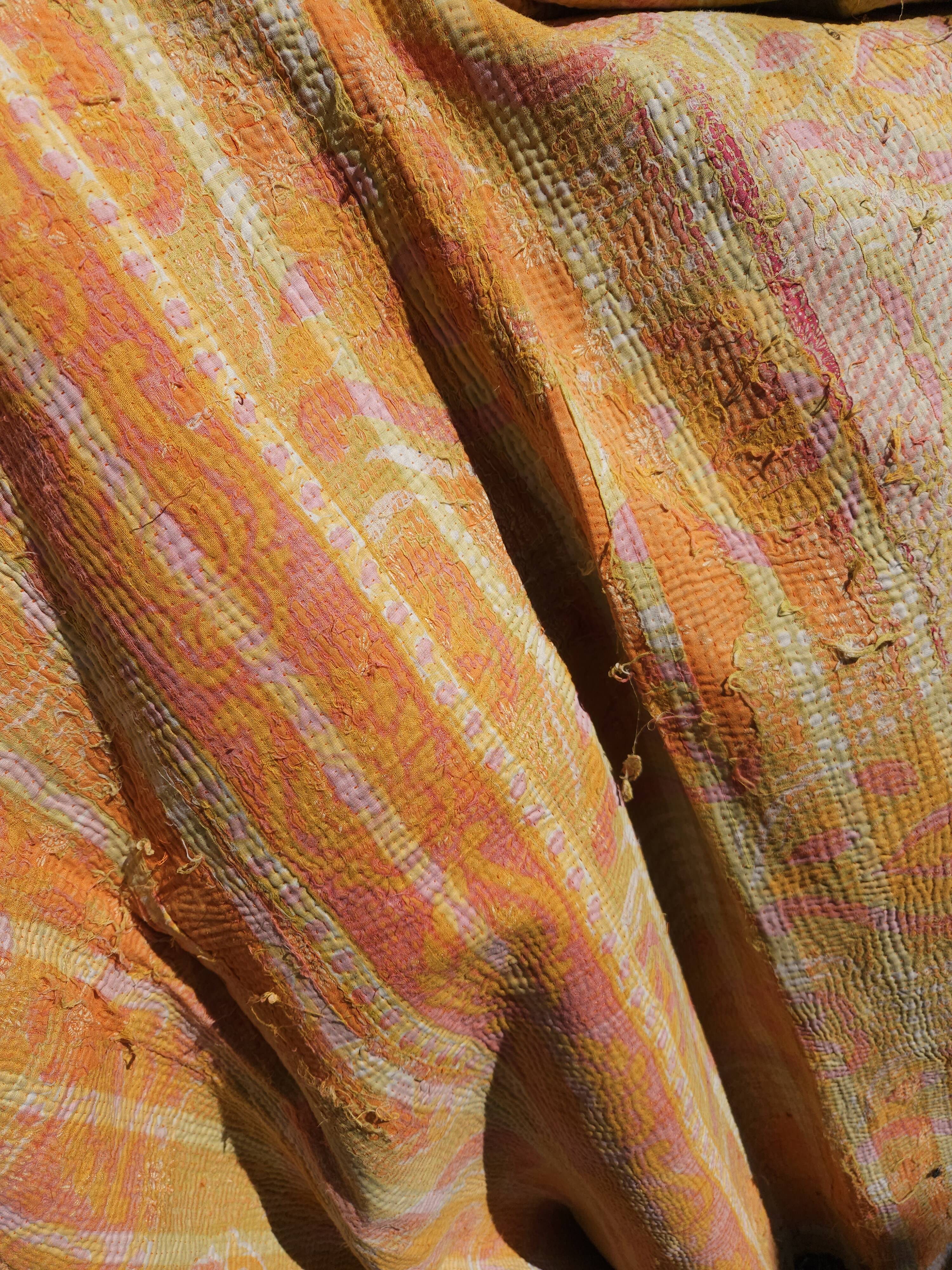 Fabric or plaid. old bed cover recycled and assembled worn deliberately