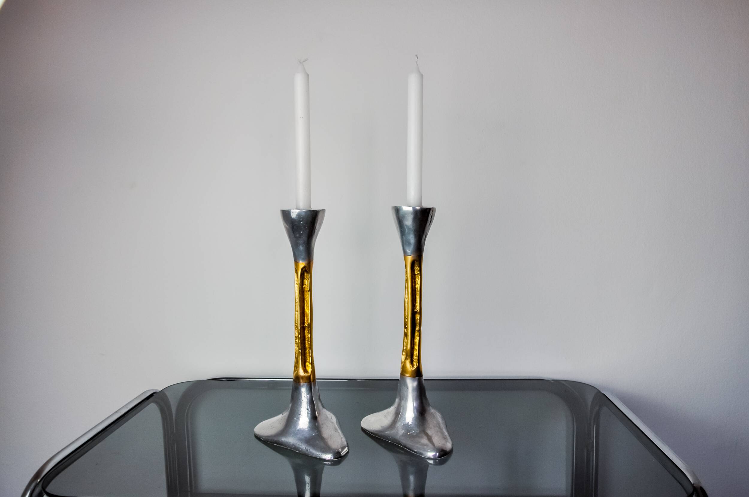 Pair of Brutalist candlesticks by David Marshall, bronze and aluminum, Spain, 1970