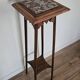 High plant stand in carved wood and Art Nouveau marble.