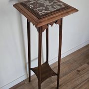 High plant stand in carved wood and Art Nouveau marble.