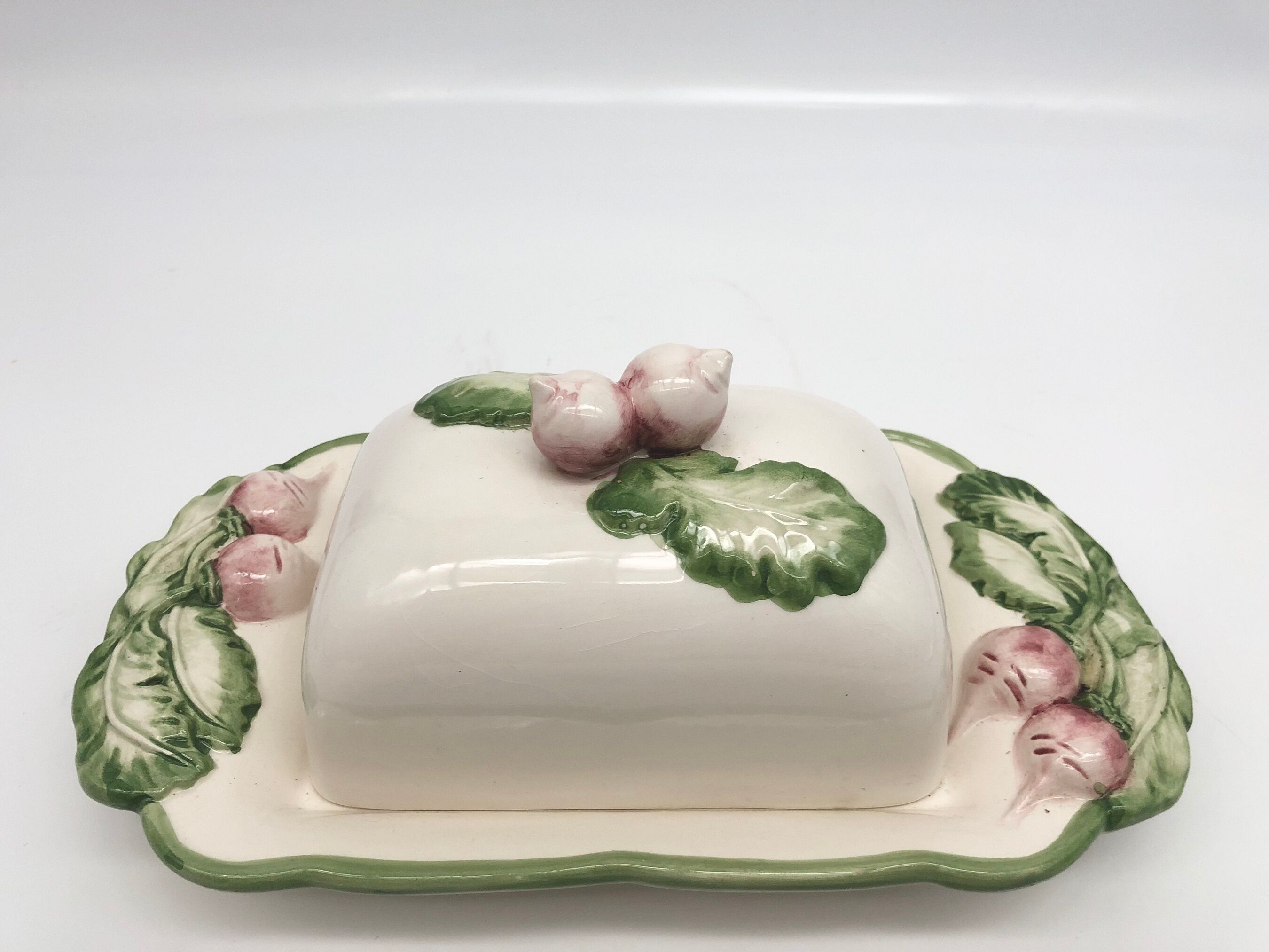 Slurry butter dish, with radish drawings. Signed "FG"