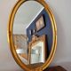 Large oval mirror gilded wood with red plate 44x66cm