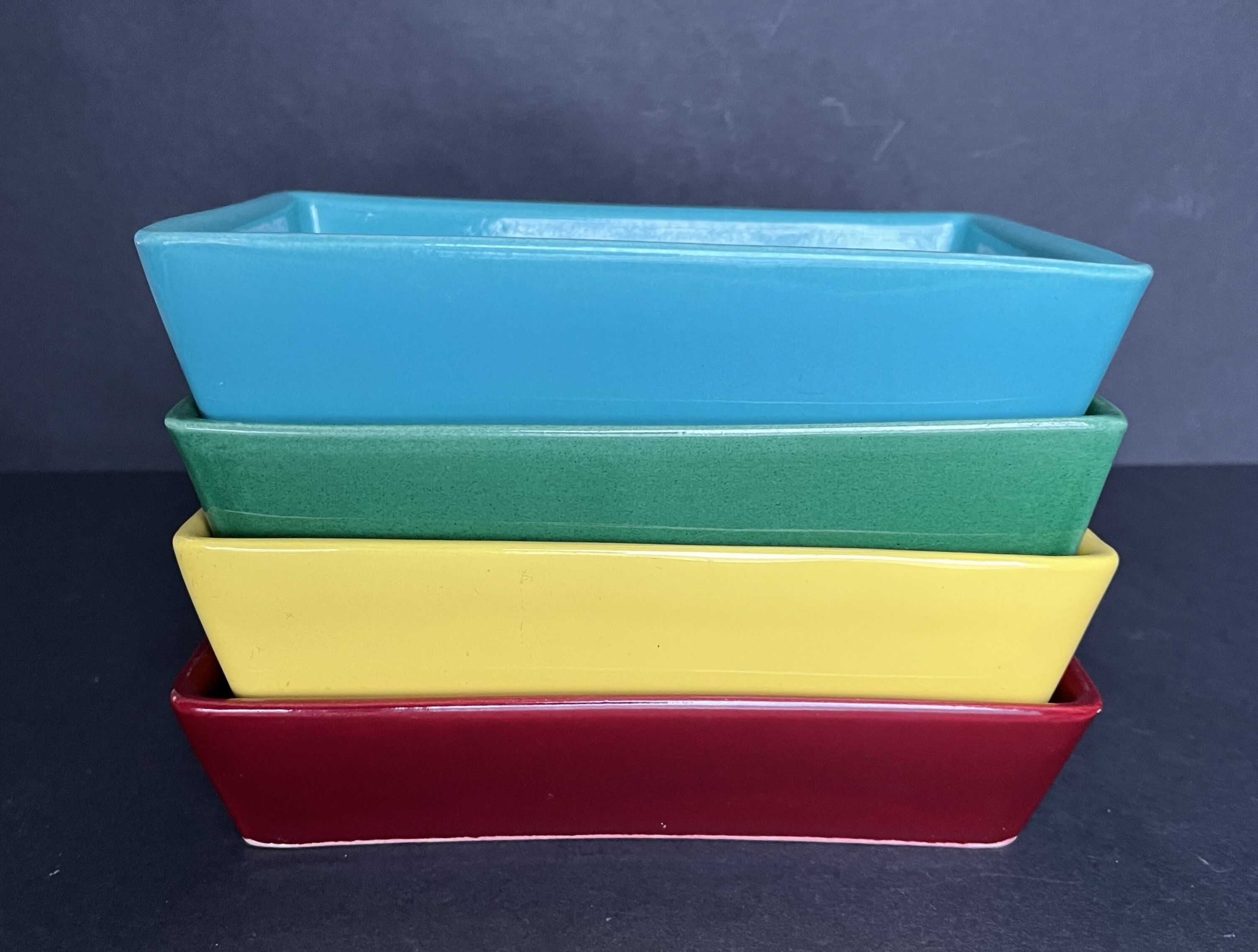 4 multicolored earthenware raviers