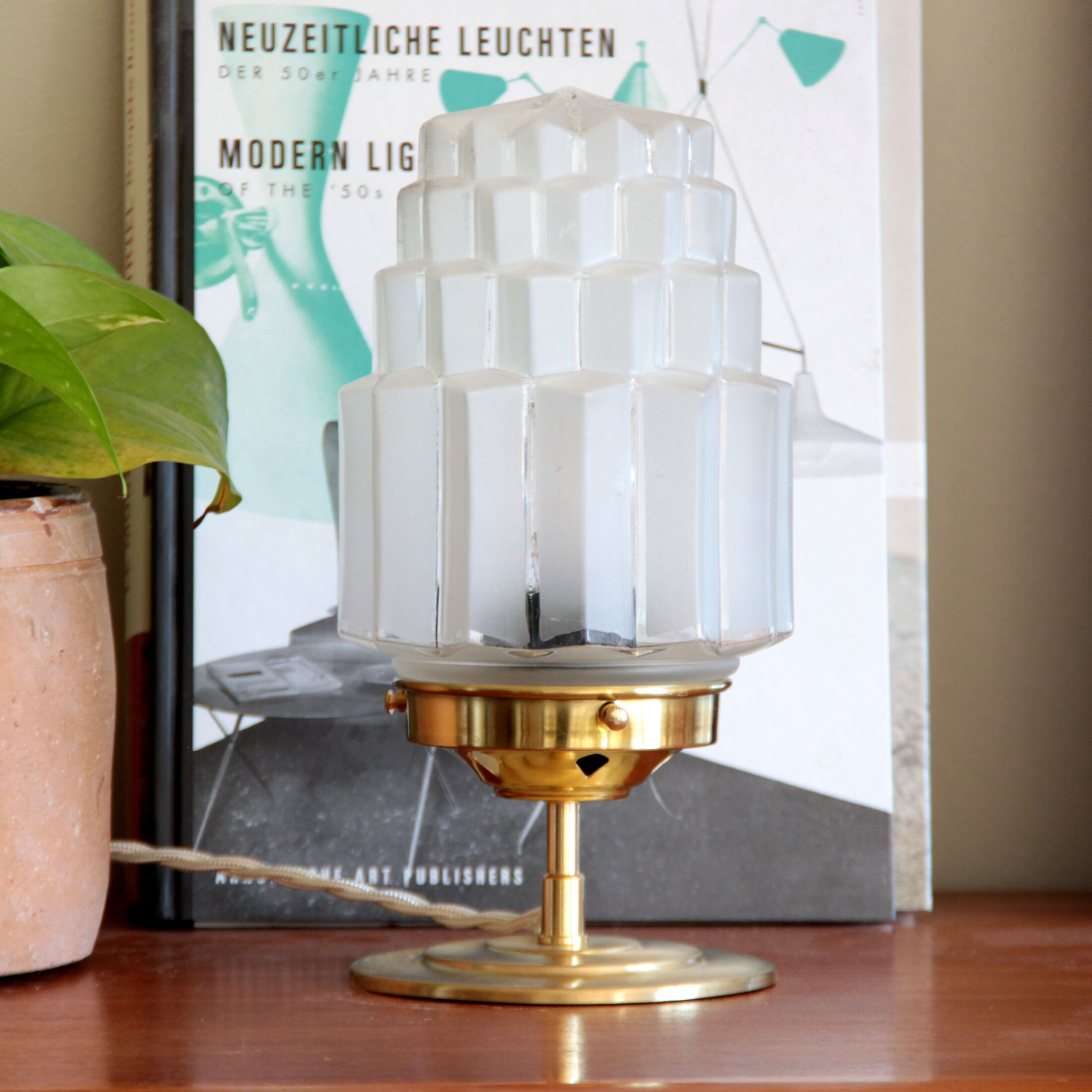 Table lamp in old glass art deco skyscraper and brass vintage bedside lamp