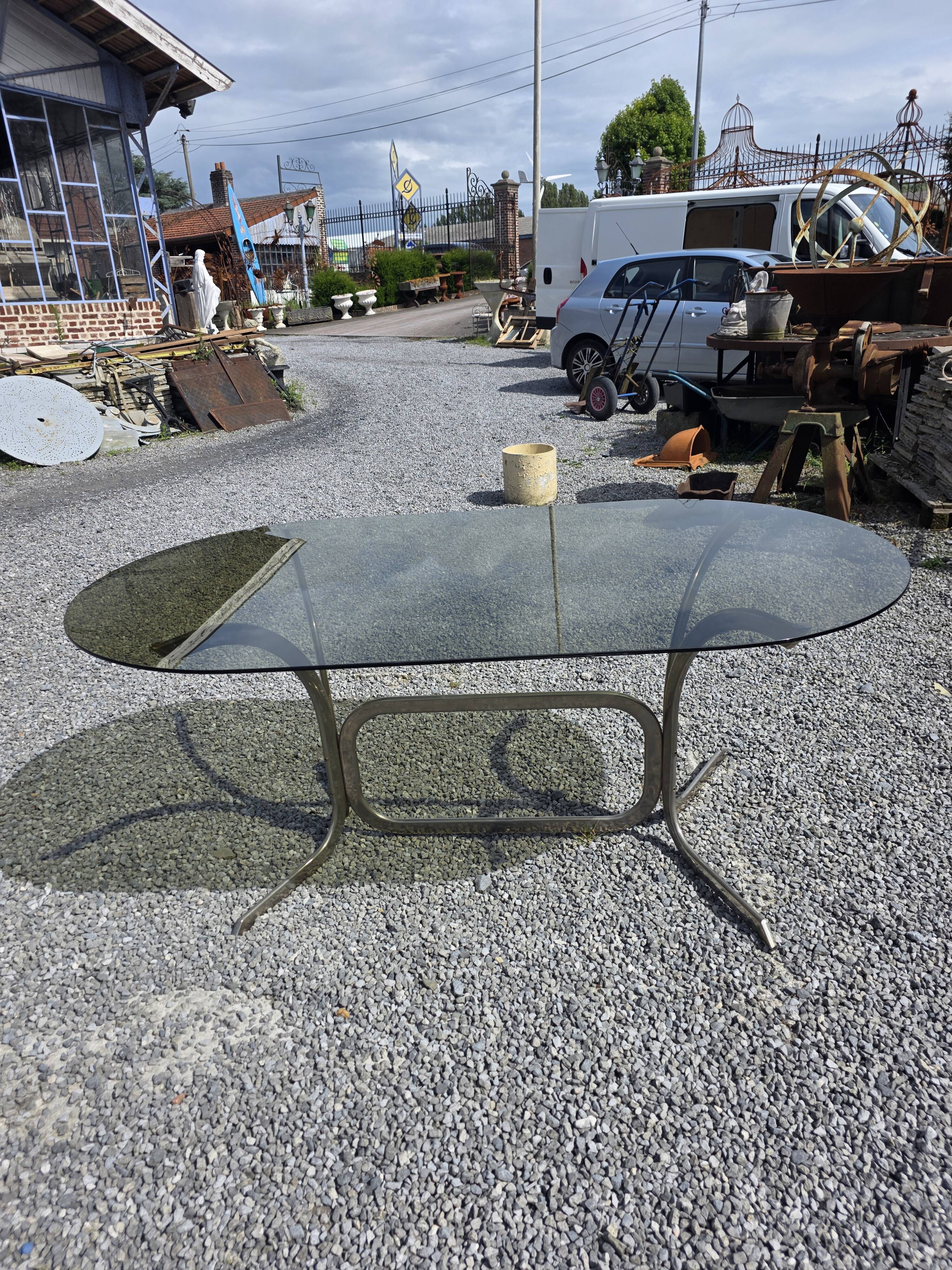 Silver metal table with smoked glass top from the 1970s.