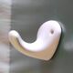 Wall-mounted coat hook in porcelain - mid 20th century
