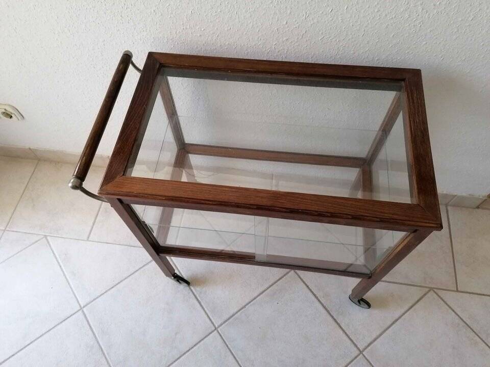 Art Deco brown wooden and glass bar cart, mobile display cabinet from the 1950s.