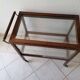 Art Deco brown wooden and glass bar cart, mobile display cabinet from the 1950s.