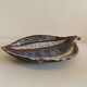 Danish ceramic dish shaped like a leaf.