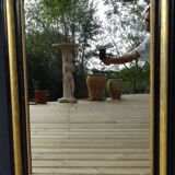 Louis Philippe mirror in blackened and gilded wood, 74 x 102 cm