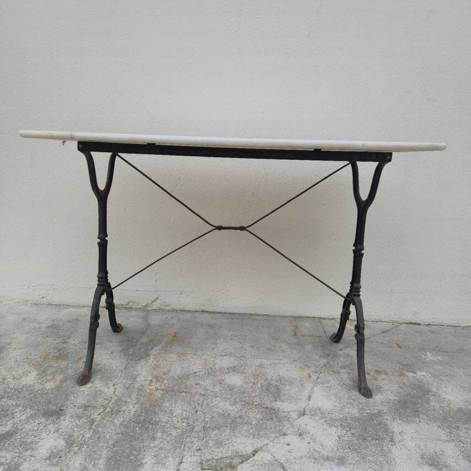 Antique cast iron and marble bistro restaurant table