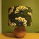 Solid wood ball lamp, lampshade with stylised wax flowers in khaki/yellow.