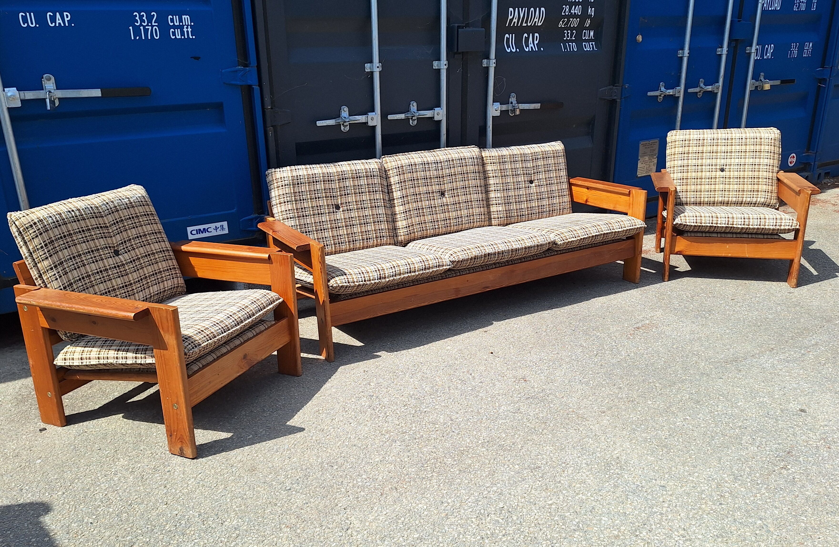 Brutalist-style bench and armchairs in 1970s pine.
