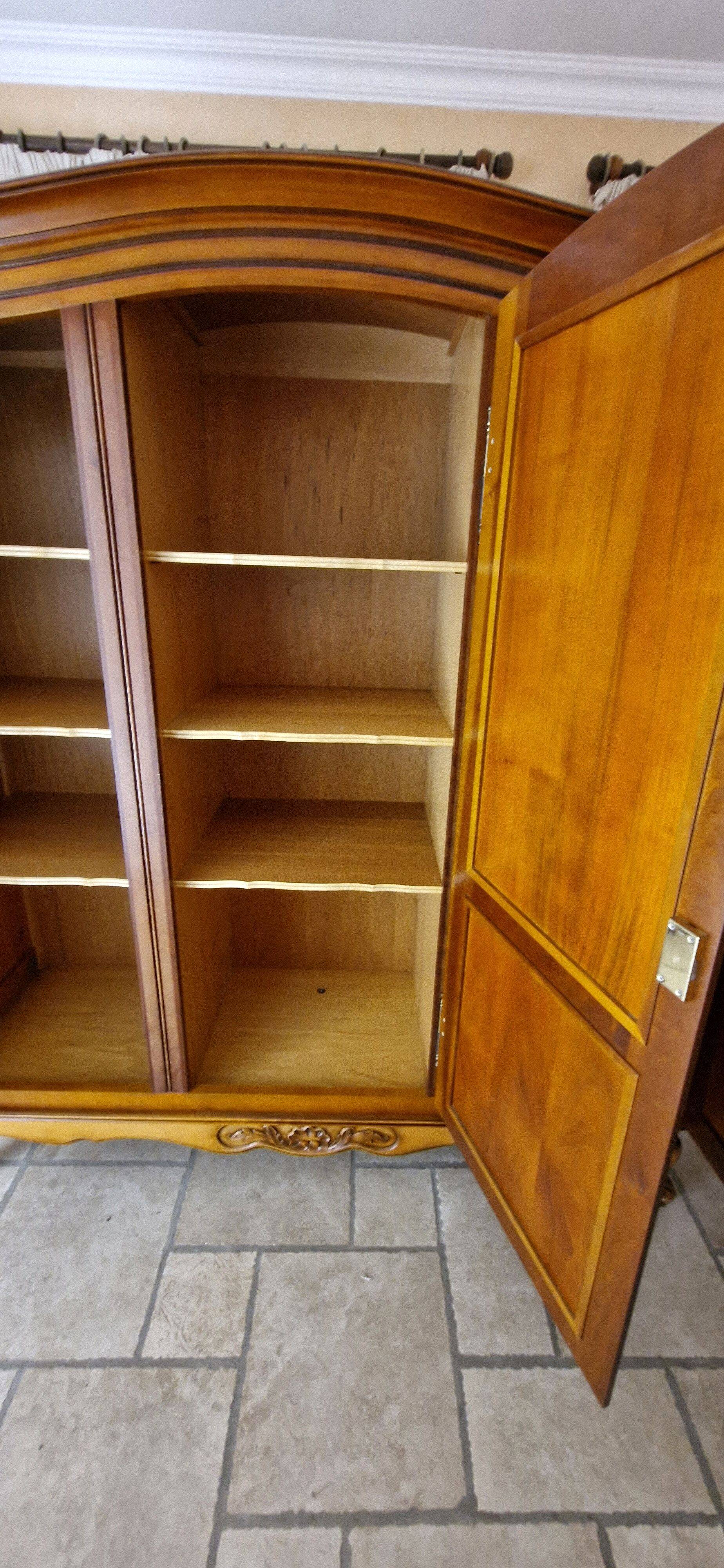 Wooden style wardrobe, 3 doors and 9 internal shelves.