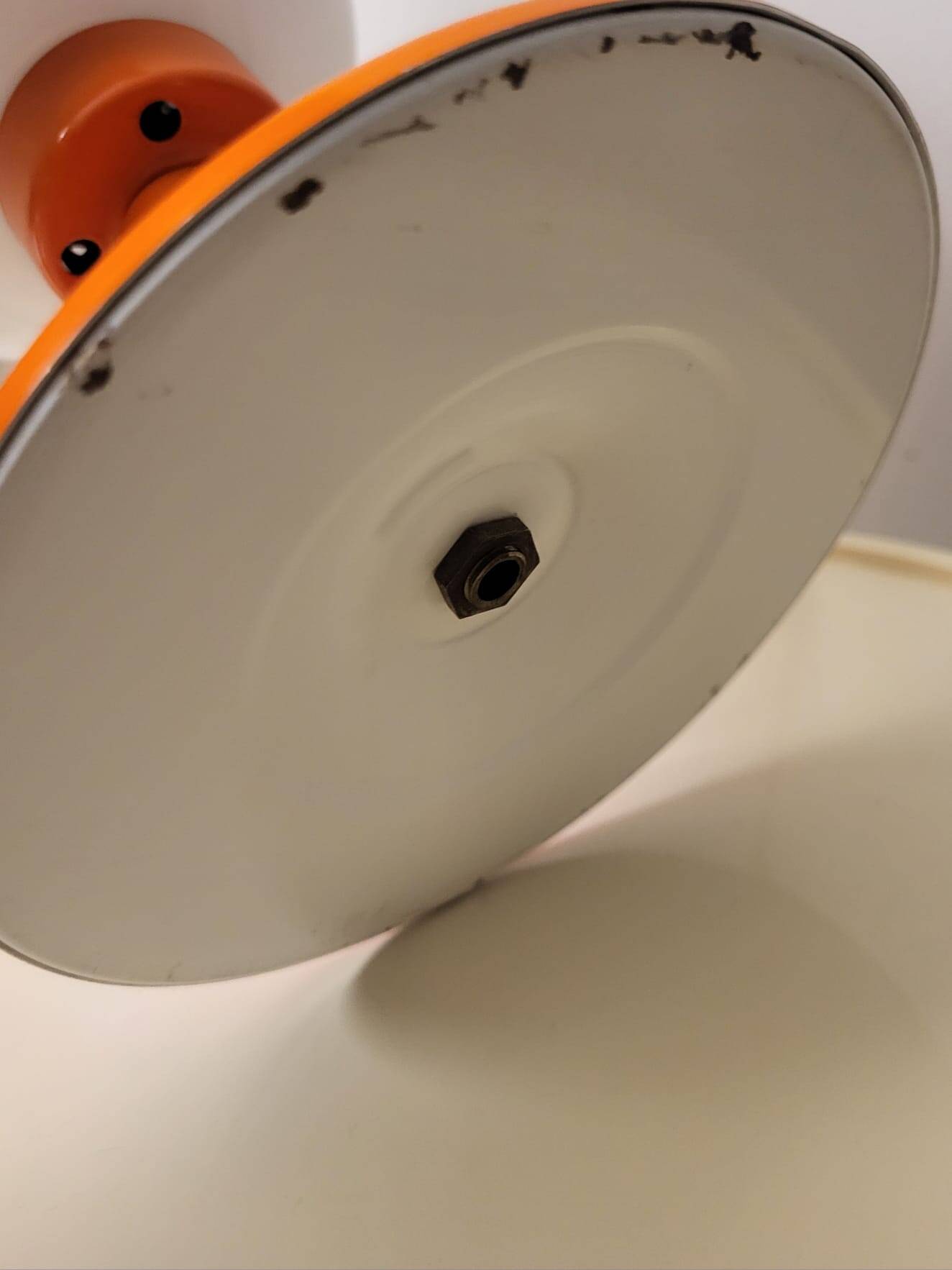 Orange metal and glass table lamp, circa 1960.