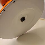 Orange metal and glass table lamp, circa 1960.