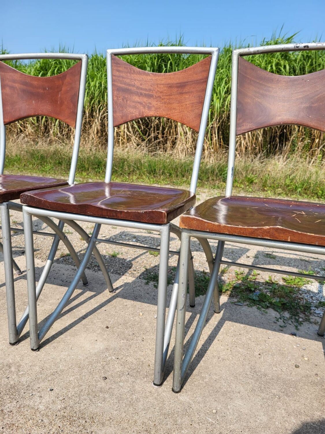 Set of 10 tubular oak bistro dining chairs in vintage industrial style.