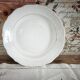 Hollow round plate in porcelain, double gold rim manufacture.