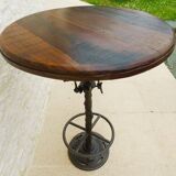Unique bistro table with its adjustable industrial cast iron leg