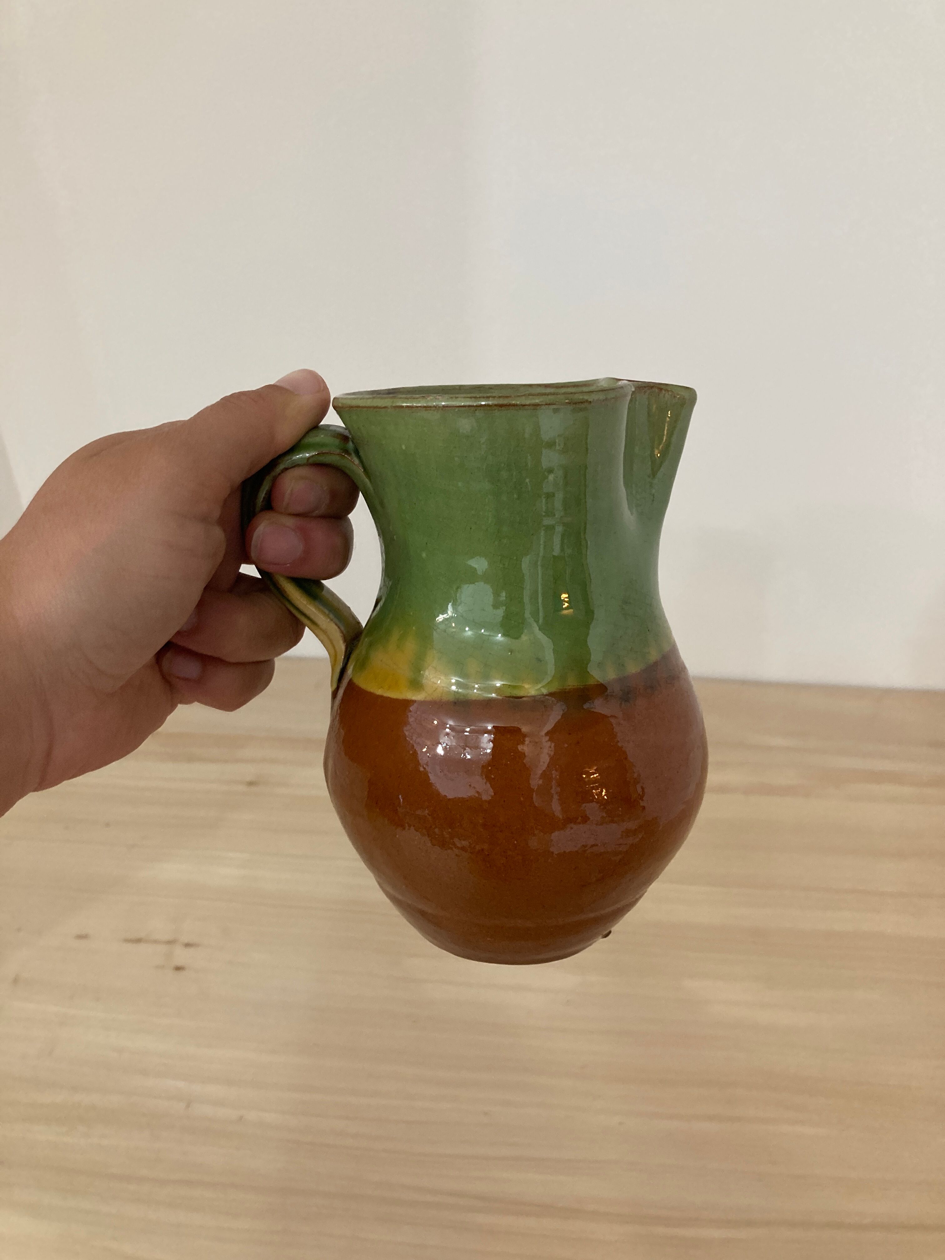 Green and brown ceramic pitcher