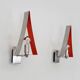 Pair of triangular wall sconces in chrome metal and orange. 1970s.