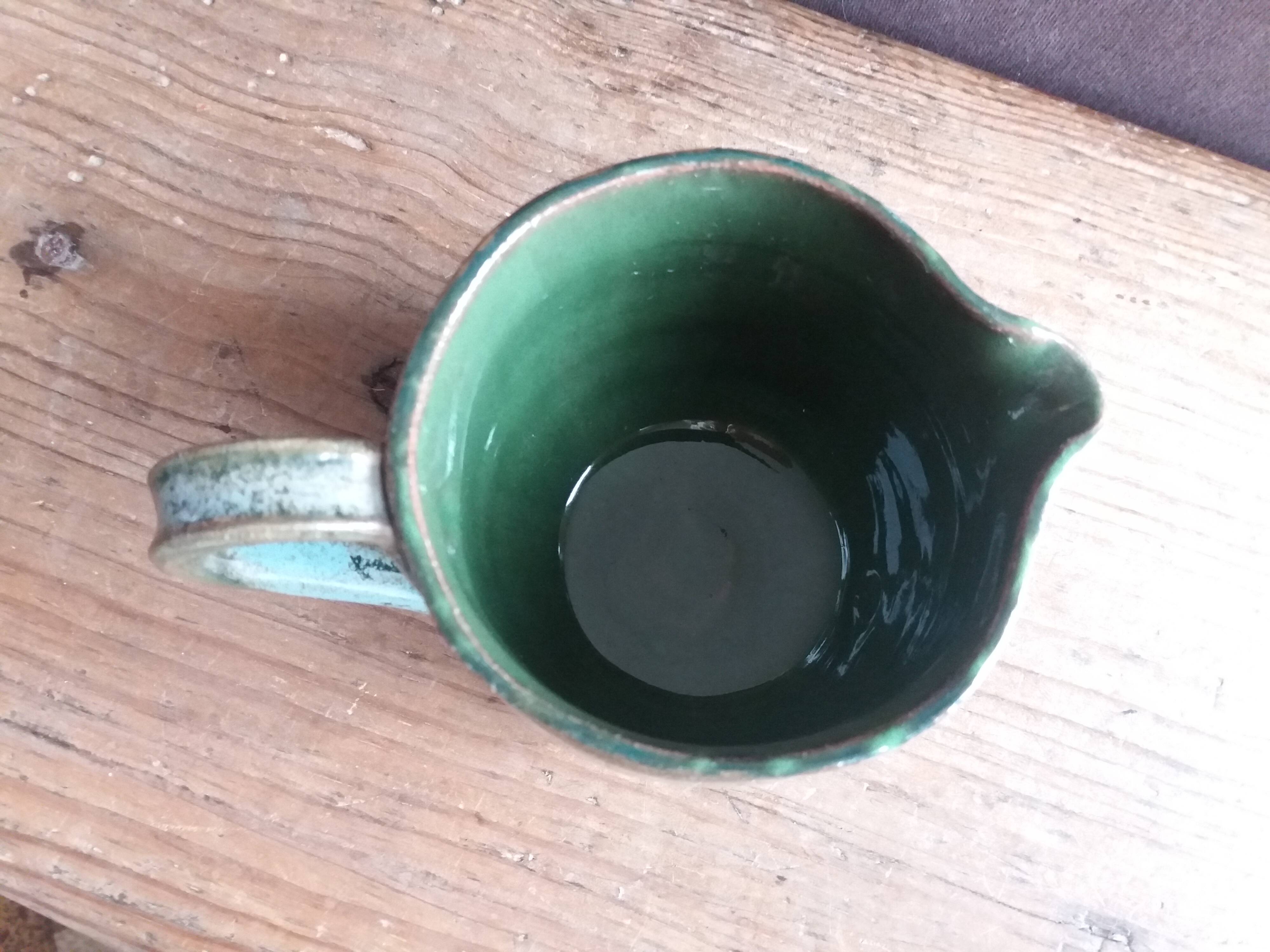 Handcrafted enameled terracotta pitcher signed