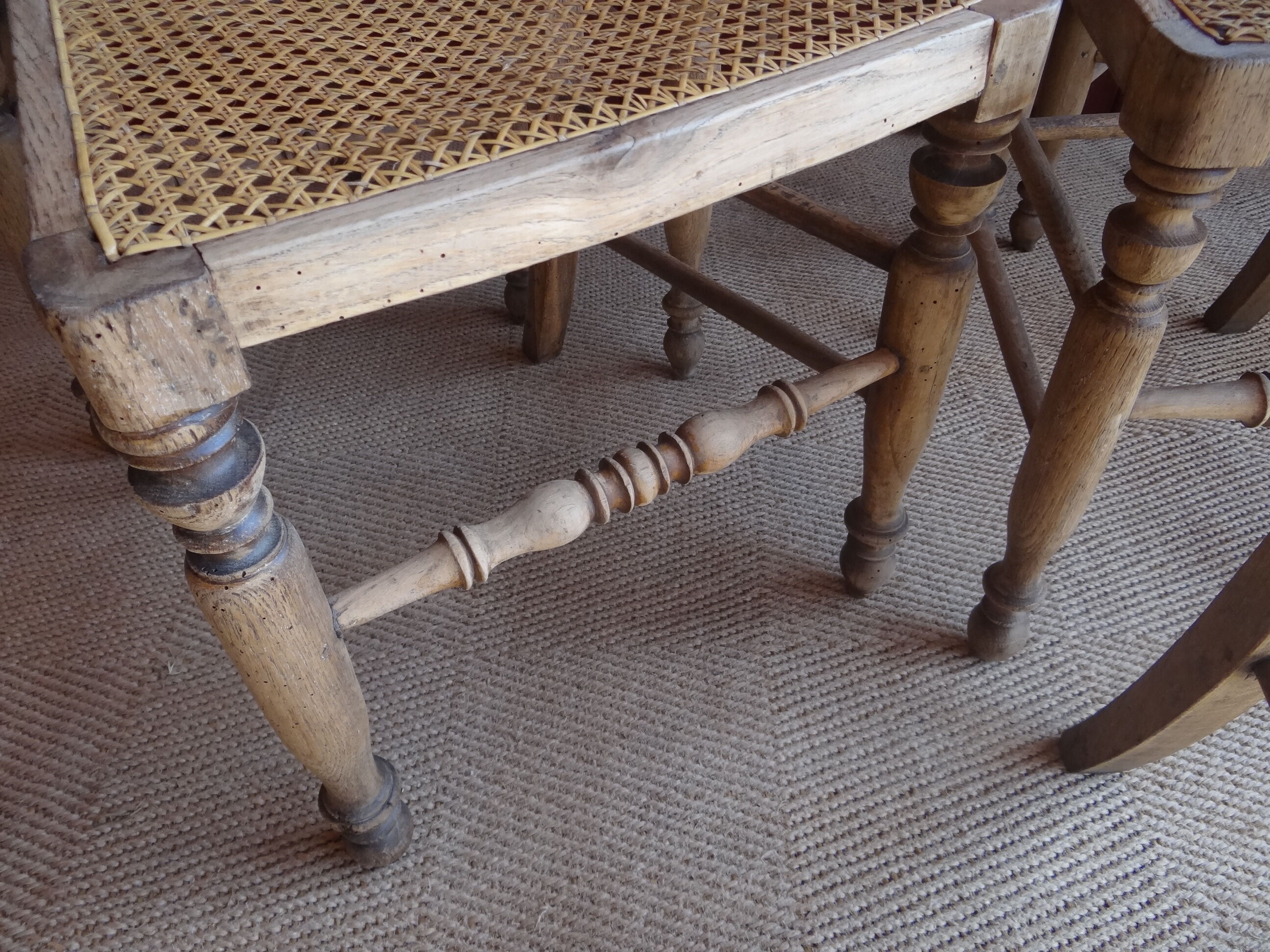 Suite of oak chairs; canated seats