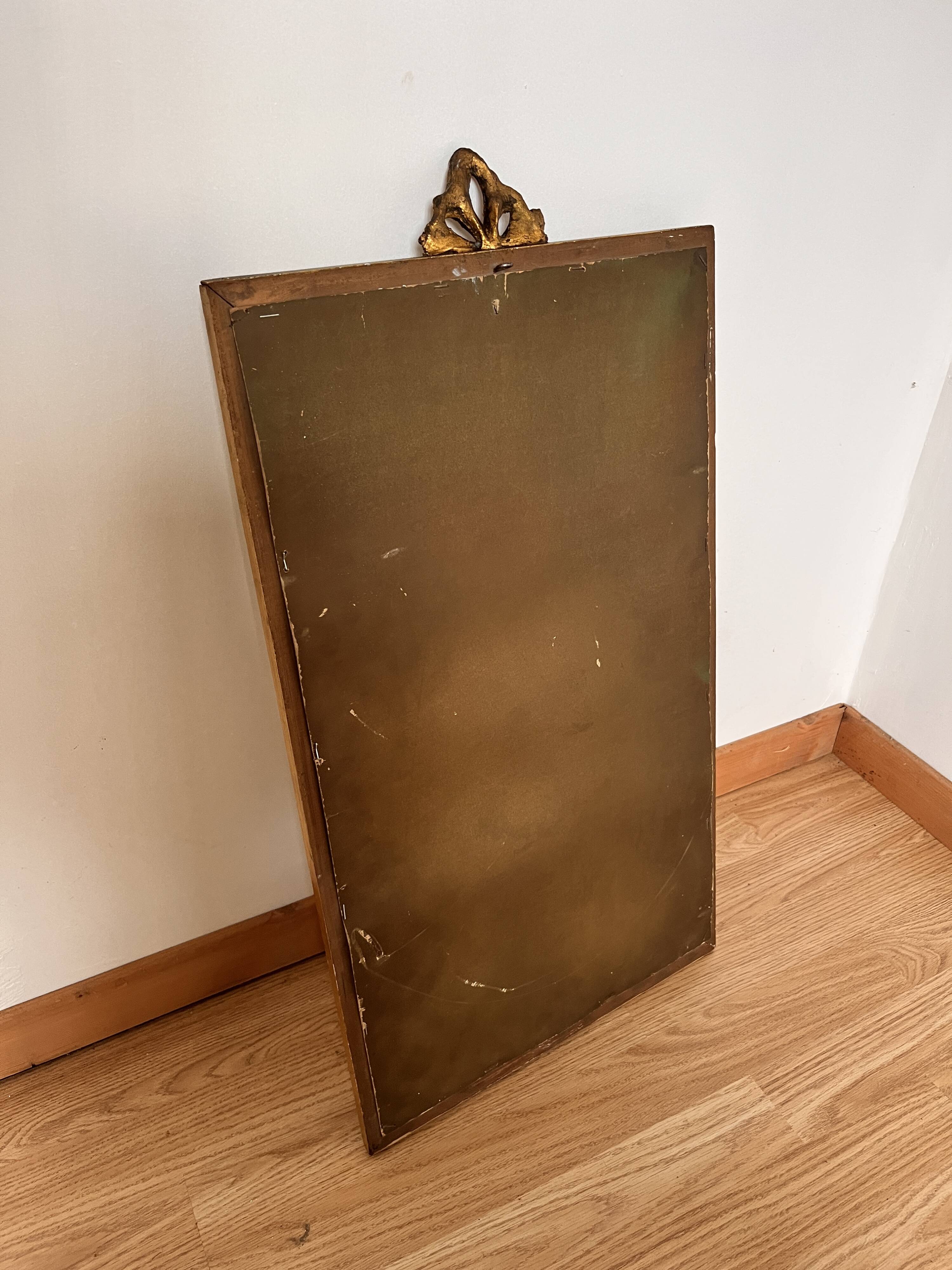 Golden mirror in Louis XVI style