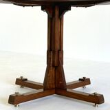Wooden round dining table from ISA Bergamo with unique base