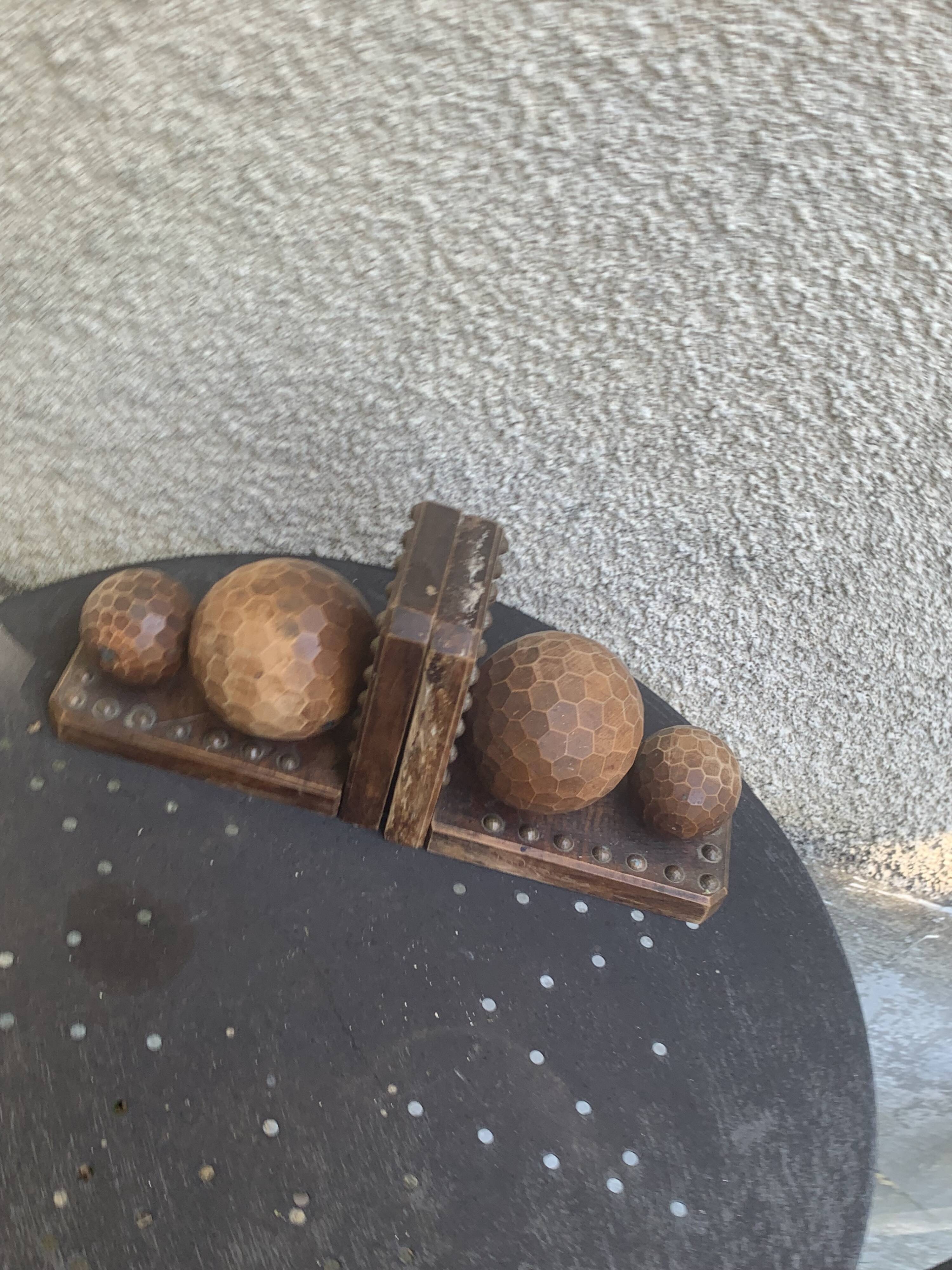 Pair of vintage carved wood and metal ball bookends