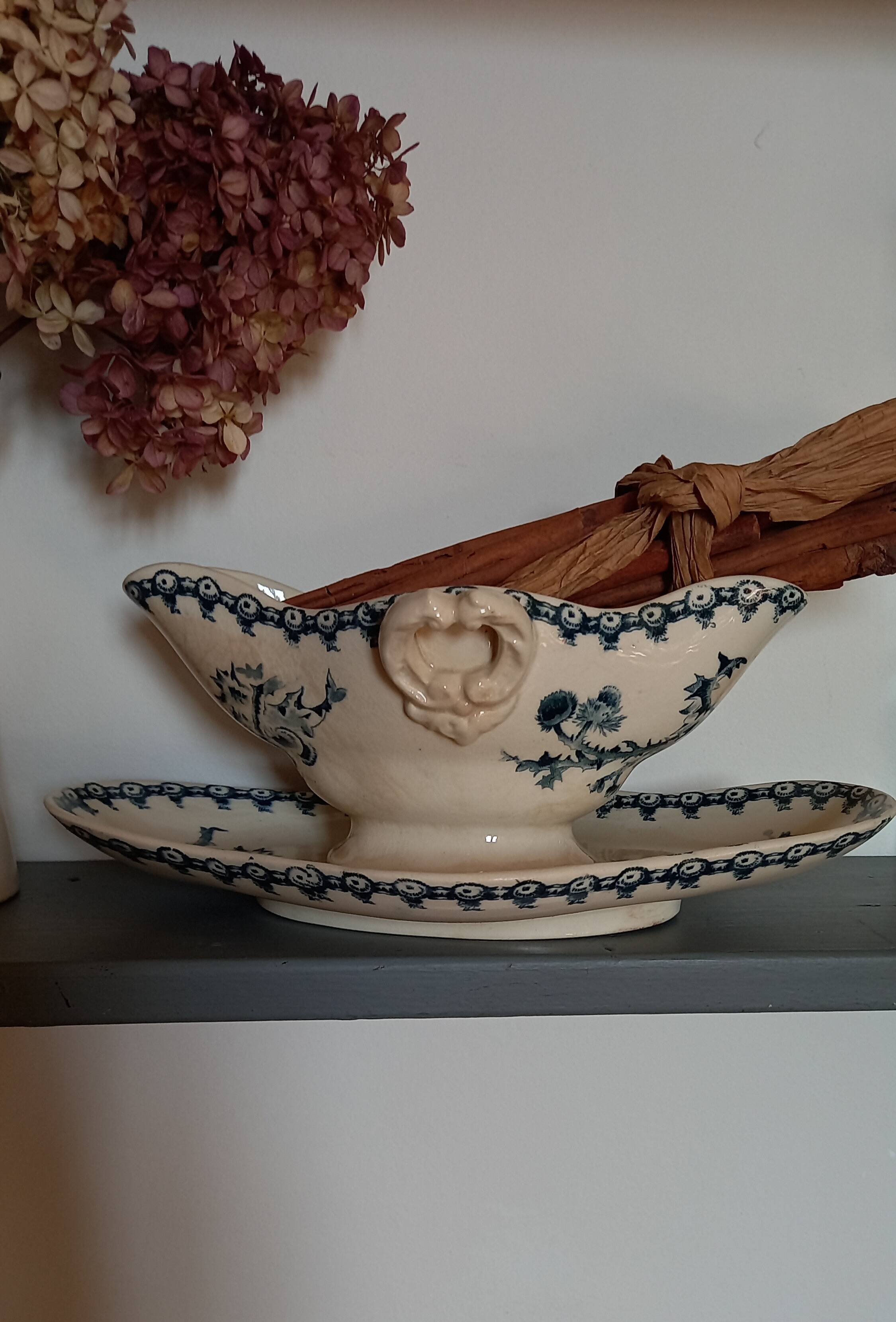 Old gravy boat on frame in terre de fer earthenware by gien, “chardons” model in blue-green