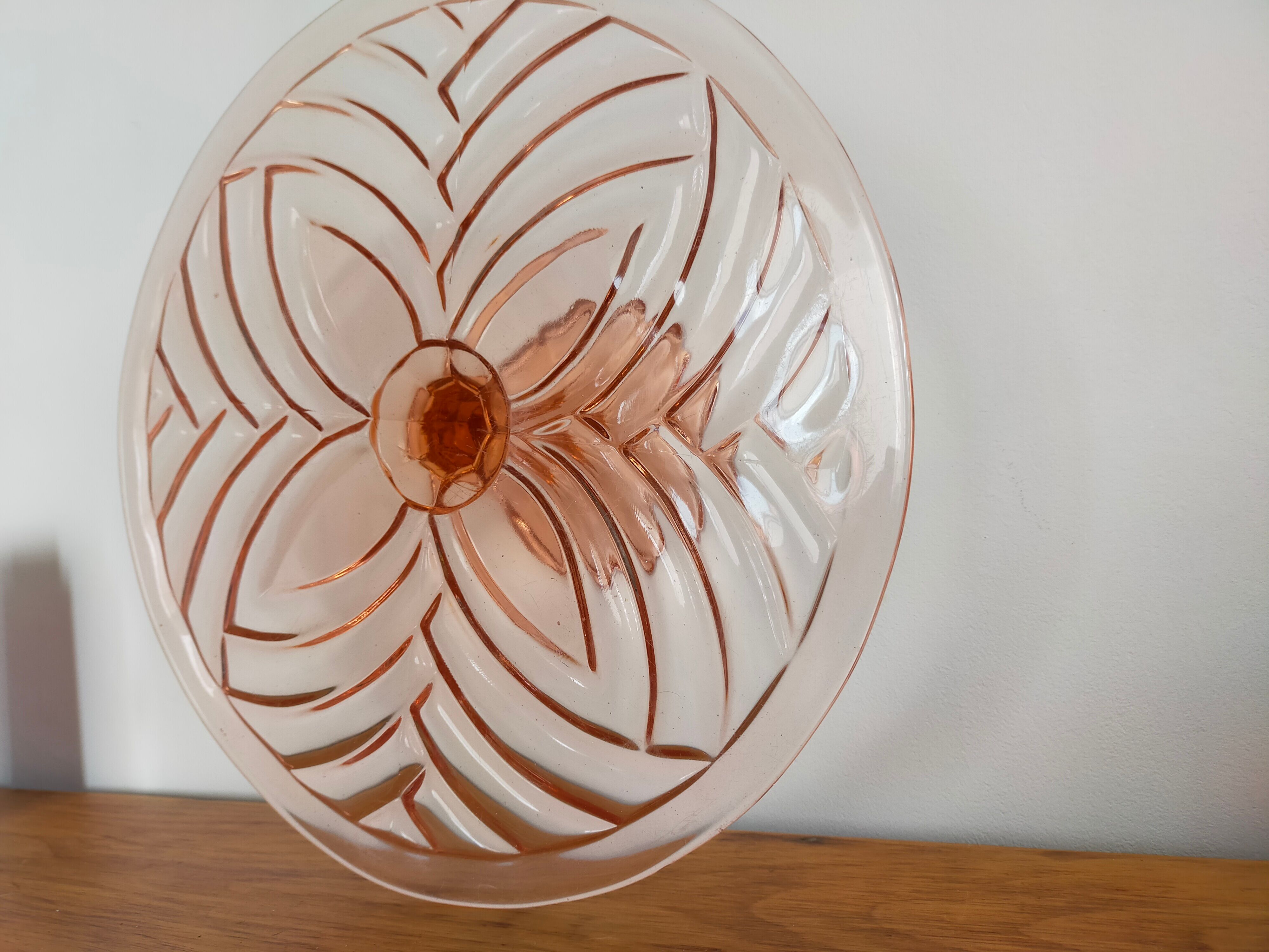 Vintage cake display in pink art deco molded glass