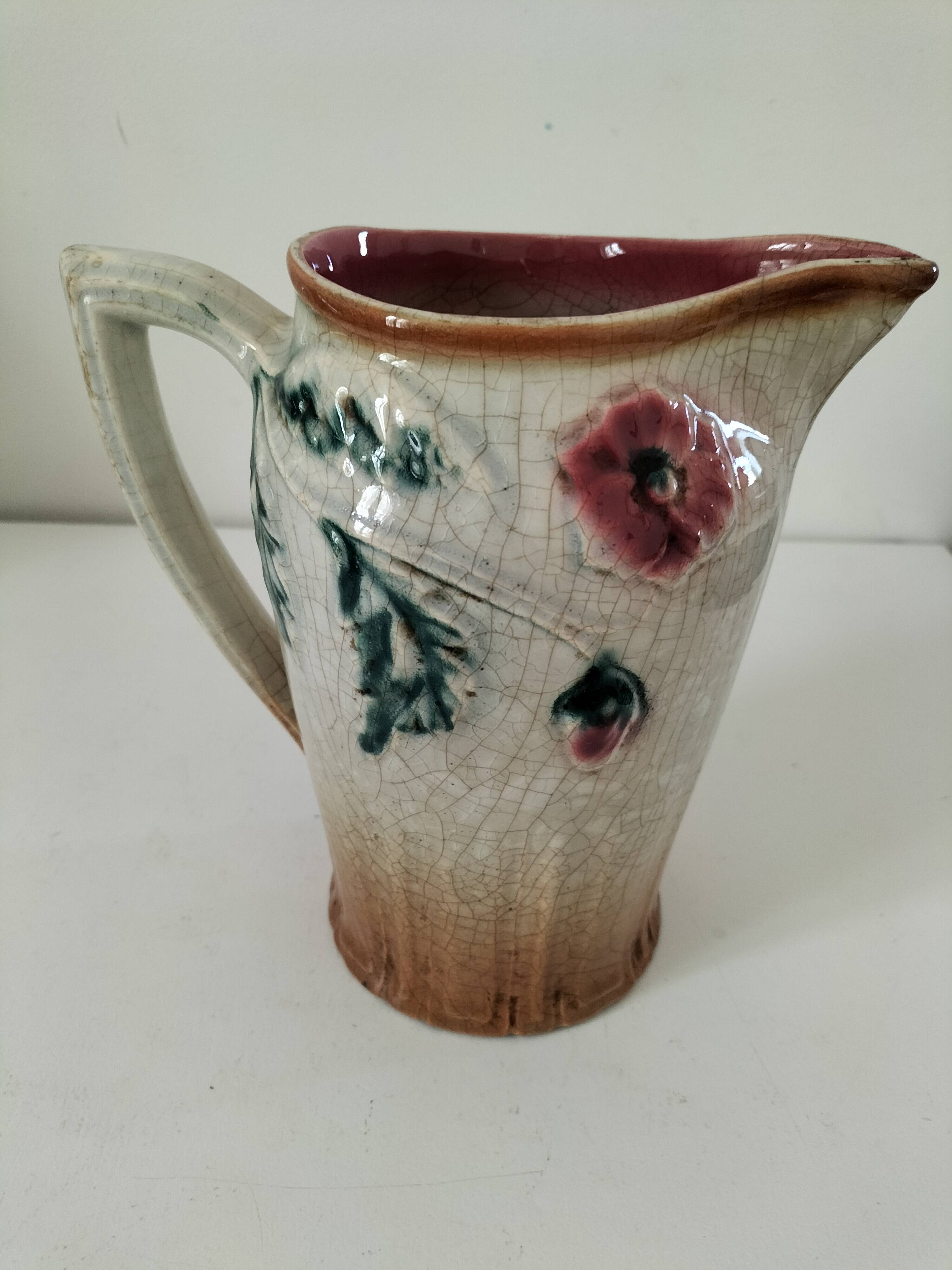 Moulded slip pitcher - late 19th century - Floral decoration in relief