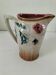 Moulded slip pitcher - late 19th century - Floral decoration in relief