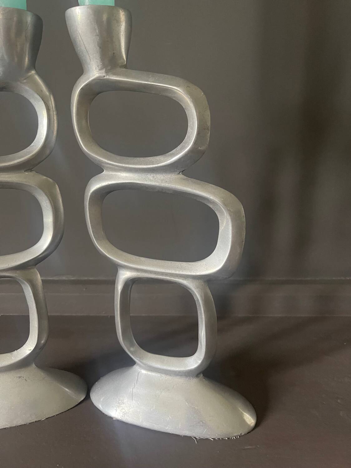Pair of aluminum candlesticks