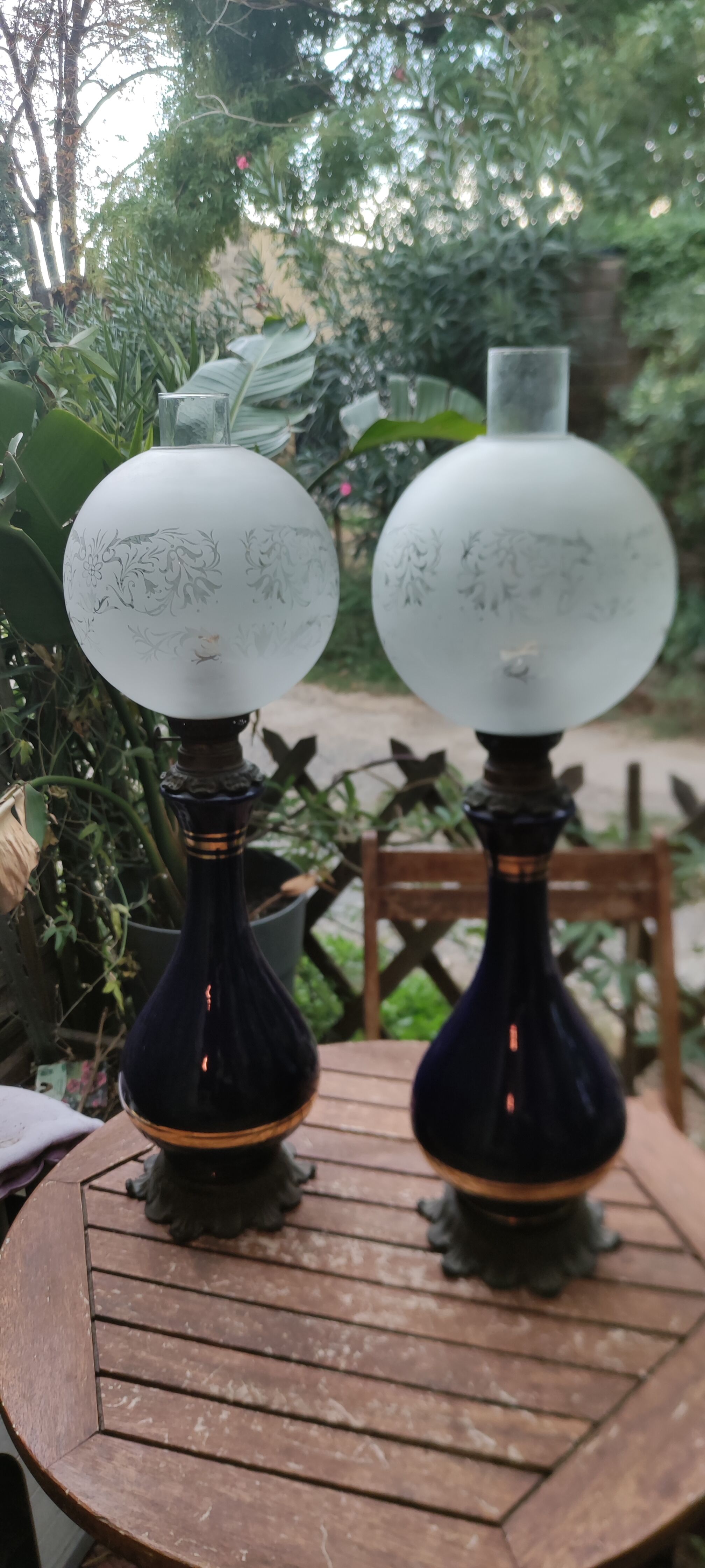 Pair of dark blue kerosene lamps