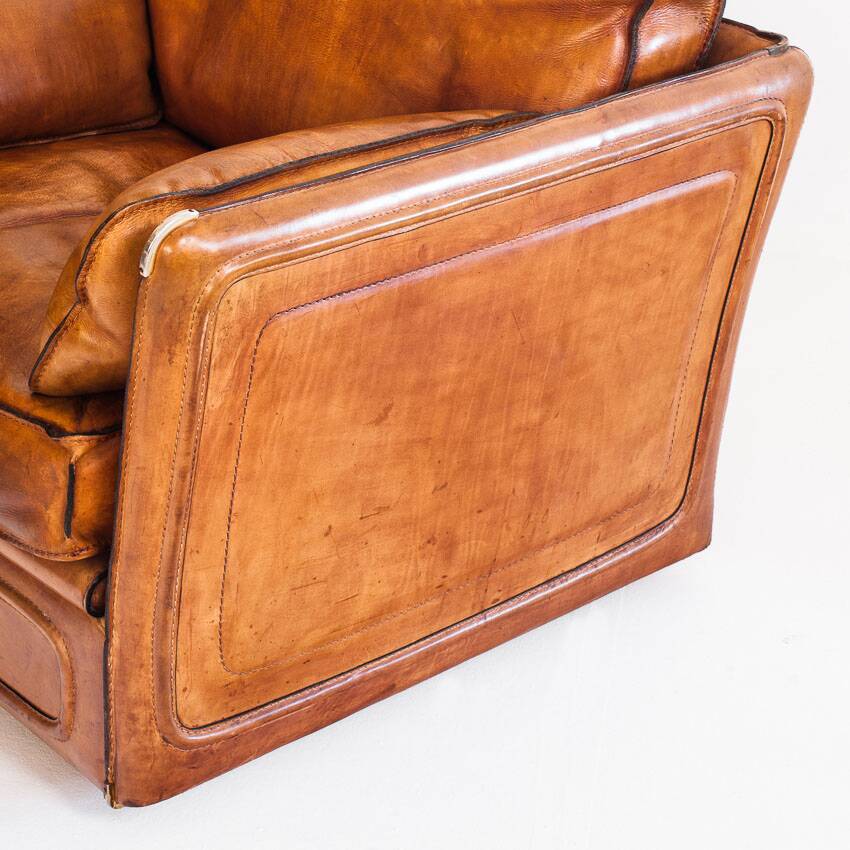 Vintage club armchair by Roche Bobois. Camel buffalo leather. France, 1980s.
