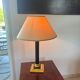 Empire style table lamp, gilded brass and black lacquered.