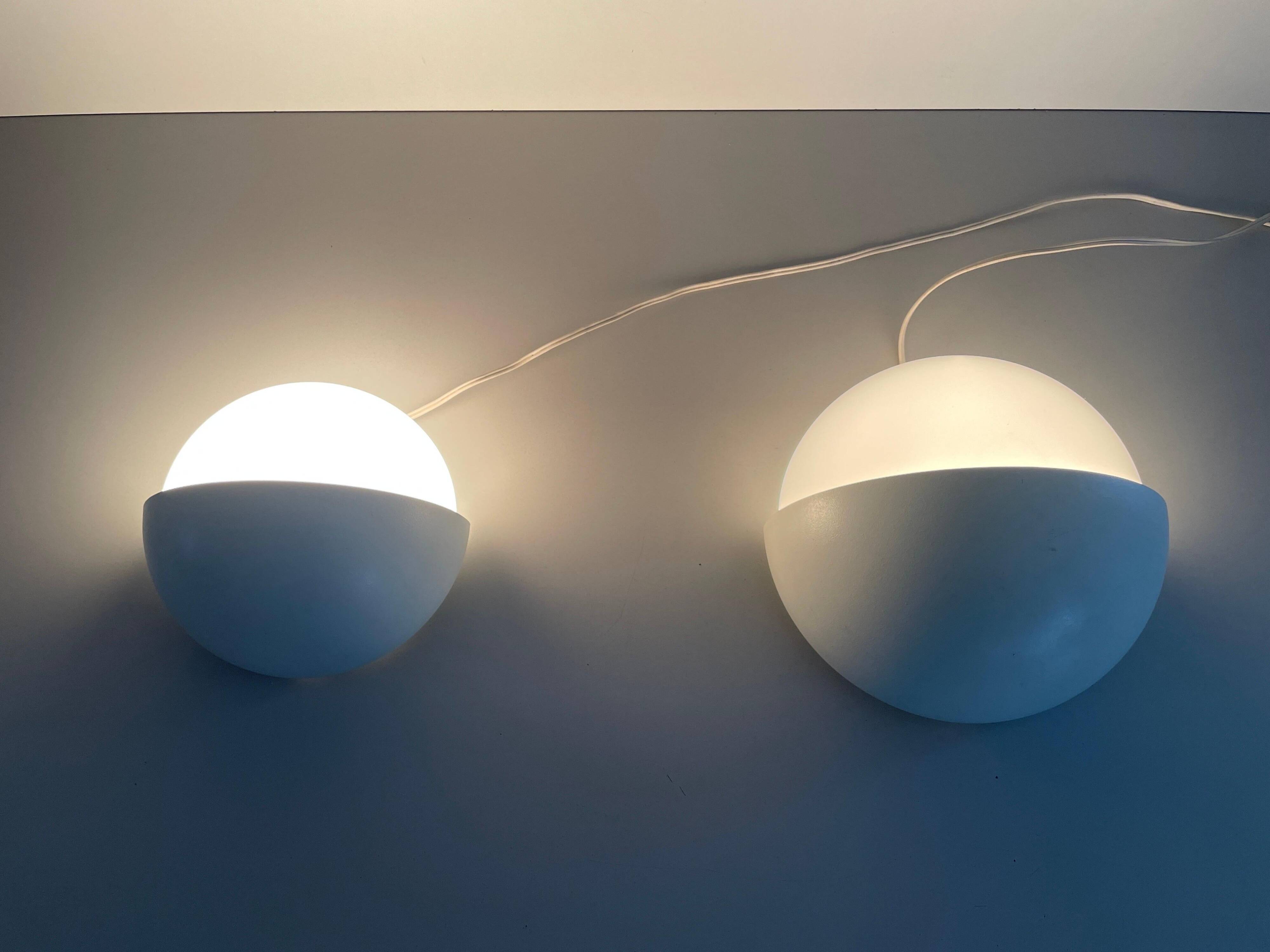 Round wall lights, small and large, in white metal by Bega, 1970s, Germany.