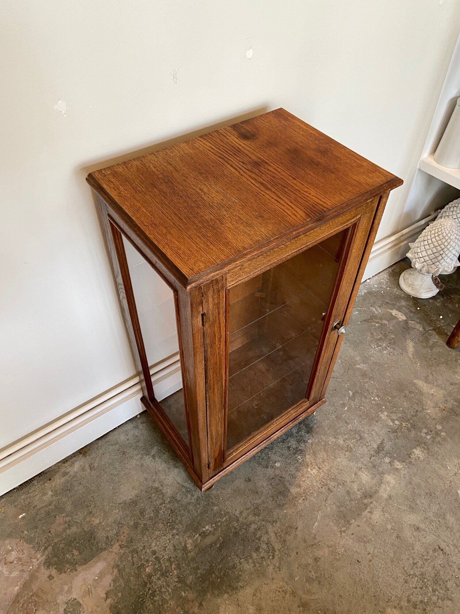 Dark wood display case and transparent glass